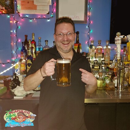 Bartender with Draft Beer at the bar at Acapulco Mexican Restaurant in Tonawanda, NY